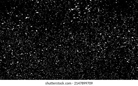 Small uneven spots and particles of debris. Abstract vector texture.  Distressed uneven background. Grunge texture overlay with fine grains isolated on white background. Vector illustration. EPS10.