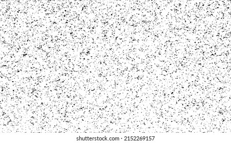 Small uneven spots and particles of debris. Abstract vector texture.  Distressed uneven background. Grunge texture overlay with fine grains isolated on white background. Vector illustration. EPS10.