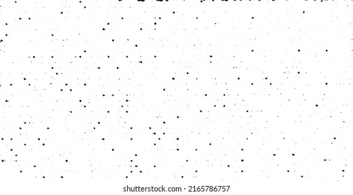 Small uneven spots and particles of debris. Abstract vector texture.  Distressed uneven background. Grunge texture overlay with fine grains isolated on white background. Vector illustration. EPS10.