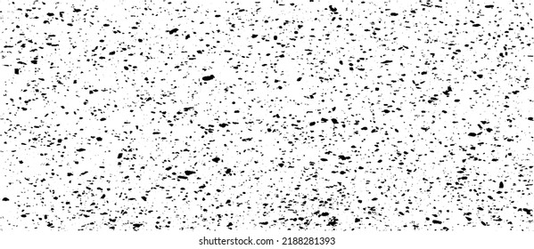 Small uneven spots and particles of debris. Abstract vector texture.  Distressed uneven background. Grunge texture overlay with fine grains isolated on white background. Vector illustration. EPS10.