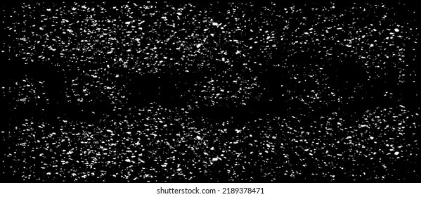 Small uneven spots and particles of debris. Abstract vector texture. Distressed uneven background. Grunge texture overlay with fine grains isolated on white background. Vector illustration. EPS10.