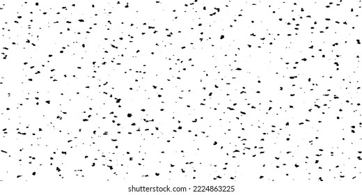 Small uneven spots and particles of debris. Abstract vector texture. Distressed uneven background. Grunge texture overlay with fine grains isolated on white background. Vector illustration. EPS10.