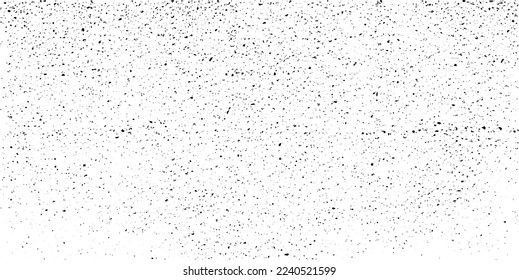 Small uneven spots and particles of debris. Abstract vector texture.  Distressed uneven background. Grunge texture overlay with fine grains isolated on white background. Vector illustration. EPS10.