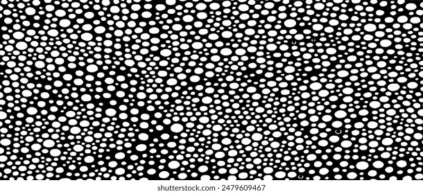 Small uneven spots and particles of debris. Abstract vector texture.  Distressed uneven background. Grunge texture overlay with fine grains isolated on white background. Vector illustration. EPS10.