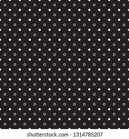 Small white circles and polka dots pattern on black background. Vector graphic.