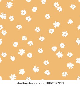 Small white flowers on a mustard background seamless pattern design. Trendy illustrated vector pattern for brand identity, stationery, wrapping, and wallpapers. Minimalistic floral background.