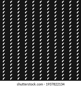 Small white fragments aligned vertically on a black background. Simple textile pattern.