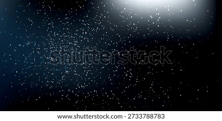 Small white particles scattered across a dark background with a bright light source in the upper right corner.