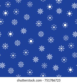 Small white snowflakes on blue background seamless pattern