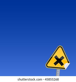 Small yellow road hazard warning sign with irritant symbol and with curved corner on sky background