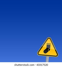 Small yellow road warning sign with sock symbol on sky background