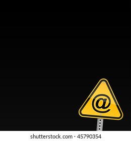 Small yellow road warning sign with commercial at symbol on black background