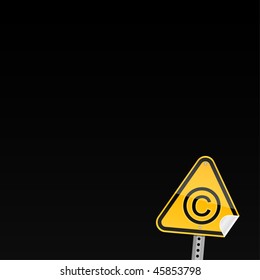 Small yellow road warning sign with copyright symbol and with curved corner on black background