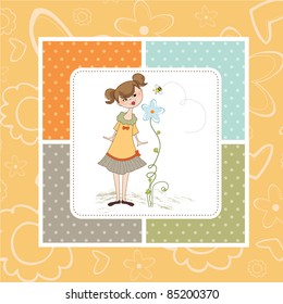 small young lady who smells a flower