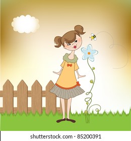 small young lady who smells a flower