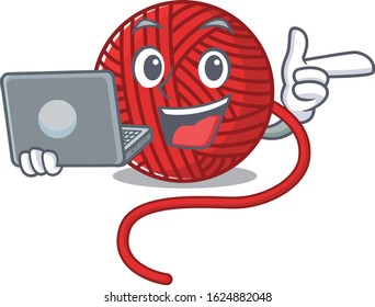 Smart character of red wool yarn working with laptop