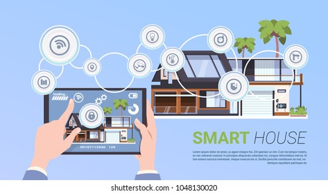 Smart Home Automation And Control Technology Concept With Hands Holding Digital Tablet
