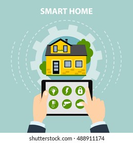 Smart home concept. Hands hold tablet and control home system as energy, conditioning, temperature and more. Wireless system.
