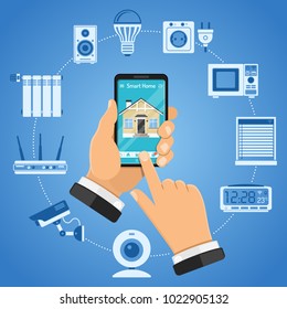 Smart Home and internet of things concept with flat icons. Man holding smartphone in hand and controls smart home devices like security camera, router, lightbulb. Isolated vector illustration