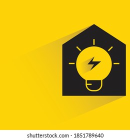 smart home and light bulb with shadow on yellow background