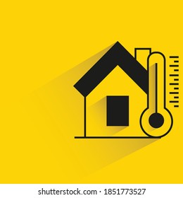 smart home and thermometer with shadow yellow background