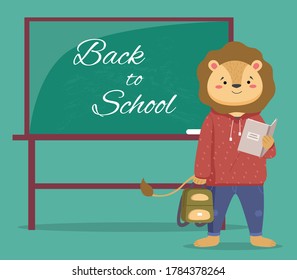 A smart lion schoolboy holding exercise book and backpack standing near school board with phrase Back to school. Funny cartoon animal student. Elementary school education concept, primary school year