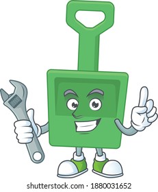 A smart mechanic green sand bucket cartoon mascot design fix a broken machine. Vector illustration