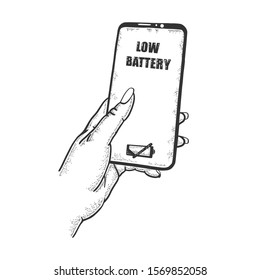 Smart phone in hand with low battery sign sketch engraving vector illustration. Scratch board style imitation. Hand drawn image.