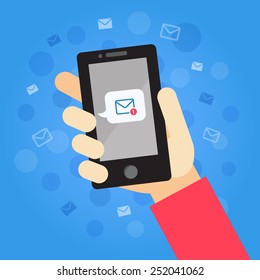 Smart phone in hand with message (email). On the blue background with envelops and dots.