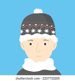 Smart teenager boy winter portrait. Man in cozy hat with ornament and fluffy scarf