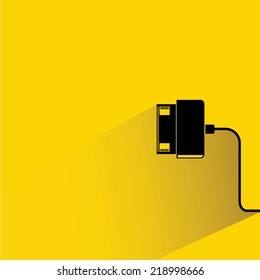 smartphone charging on yellow background, flat and shadow theme design