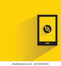 Smartphone y brújula icono con sombra sobre fondo amarillo