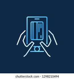 Smartphone with credit card in hands vector colored outline icon or sign on dark background 