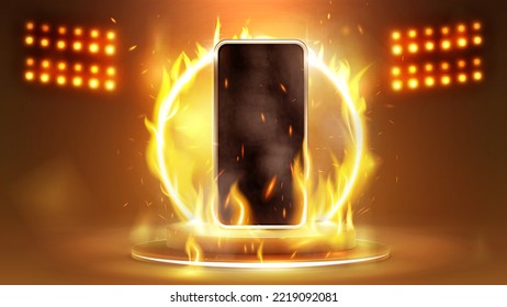 Smartphone in fire on podium with fire ring on background