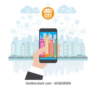 Smartphone in hand helps to focus in a smart city with advanced services, and augmented reality, social networking.Background with place for text