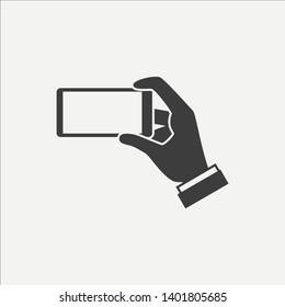 Smartphone in hands vector icon