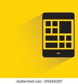 smartphone and layout with shadow on yellow background