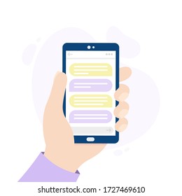 Smartphone with a messaging app. Hand holding a phone. Person chatting through an online application.