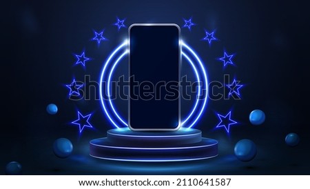 Smartphone on podium of winners with blue neon rings and neon stars in blue scene with realistic bouncing spheres  Stock photo © 