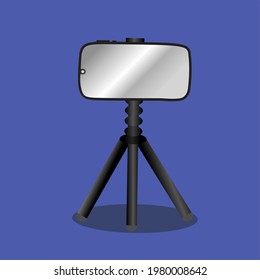 A smartphone on a tripod with a black and white gradient. Isolated in blue background