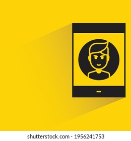 smartphone and person contact with shadow on yellow background