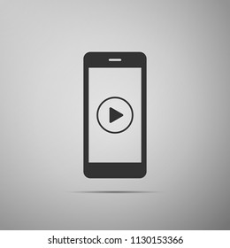 Smartphone with play button on the screen icon isolated on grey background. Flat design. Vector Illustration