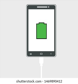 smartphone that is charging on a gray background, full battery notification