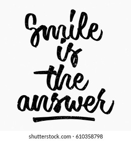 Smile is the answer quote. Ink hand lettering. Modern brush calligraphy. Handwritten phrase. Inspiration graphic design typography element. Cute simple vector sign.