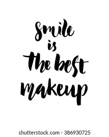 Smile is the best make up. Inspirational quote handwritten with black ink and brush, custom lettering for posters, t-shirts and cards, fashion design. Vector calligraphy isolated on white background.