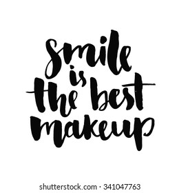 Smile is the best makeup. Inspirational quote handwritten with black ink and brush, custom lettering for posters, t-shirts and cards. Vector calligraphy isolated on white background