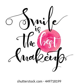 Smile is the best makeup. Inspirational quote handwritten with black ink and brush on pink watercolor stain, custom lettering for posters, t-shirts and cards. Vector calligraphy isolated on white 