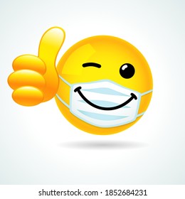 smile face with guard mouth mask showing thumb up. Yellow winking 3D emoticon wearing a white surgical mask. World Smile Day, October 4th banner vector illustration