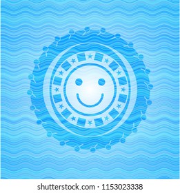 smile face icon inside light blue water emblem background.