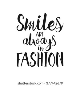 Smiles are always in fashion - Hand drawn inspirational quote. Vector isolated typography design element. Brush lettering good for posters, t-shirts, prints, banners. Housewarming hand lettering quote